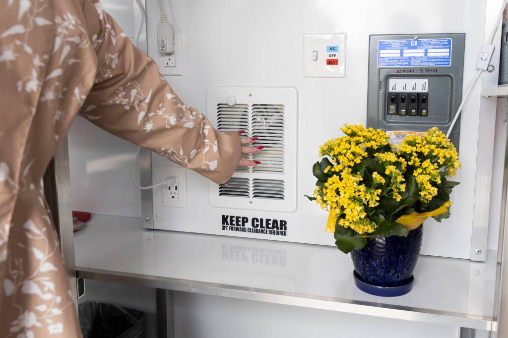 A heater and air conditioning unit inside the Pallet shelter on Monday, April 27, 2026, in Everett, Washington. (Olivia Vanni / The Herald)