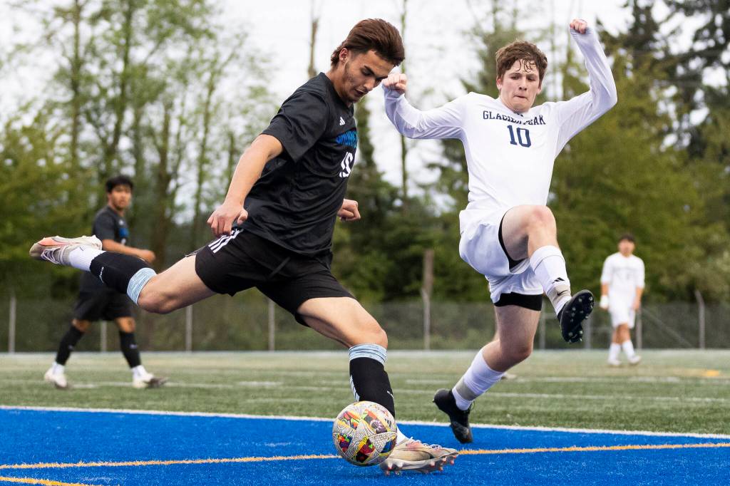 Shorewoods Tajidin Babayev clears the ball against Glacier Peaks Tyler Larsen during the game on Tuesday, April 28, 2026 in Shoreline, Washington. (Olivia Vanni / The Herald)
