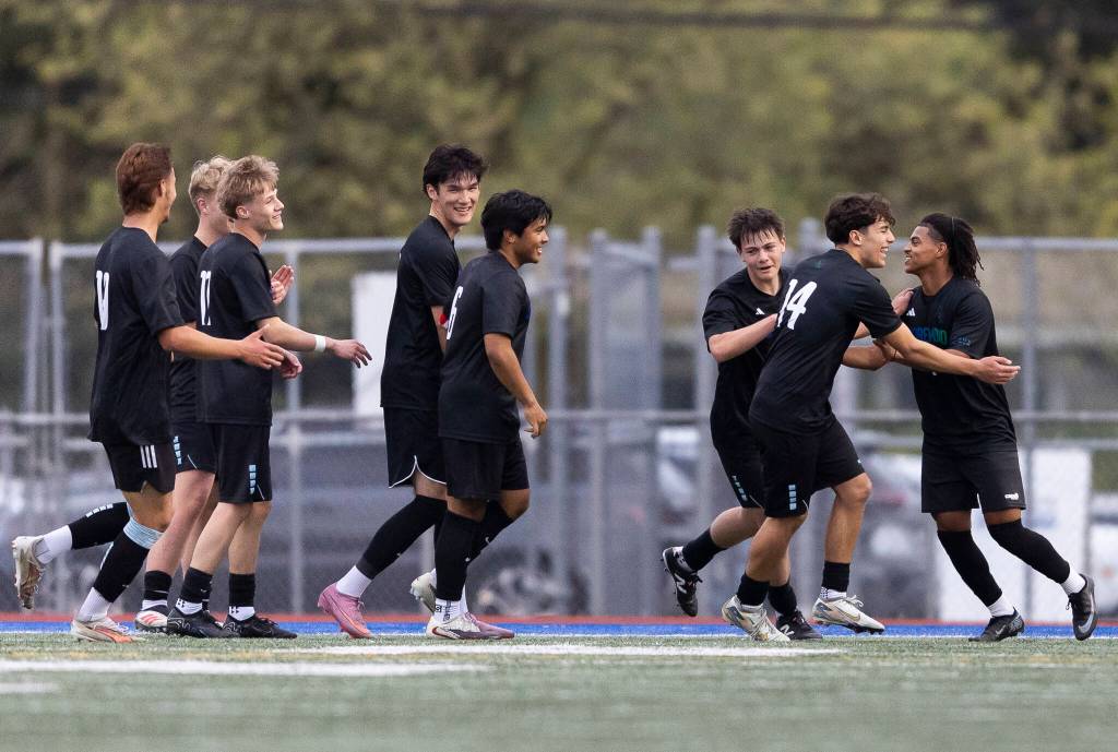 Shorewoods Meiron Bereket celebrates with his teammates after scoring during the game against Glacier Peak on Tuesday, April 28, 2026 in Shoreline, Washington. (Olivia Vanni / The Herald)