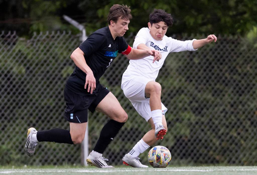 Shorewoods Tallyn Lord and Glacier Peaks Ashton Resendiz battle for the ball during the game on Tuesday, April 28, 2026 in Shoreline, Washington. (Olivia Vanni / The Herald)