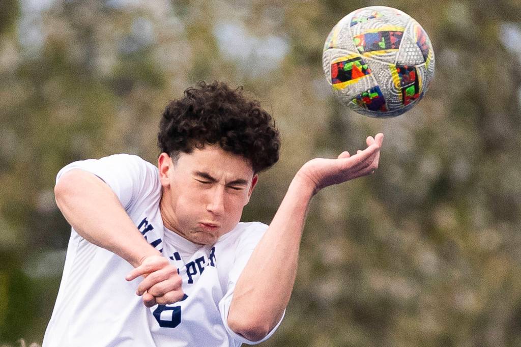 Glacier Peaks George Vankovsky heads the ball during the game against Shorewood on Tuesday, April 28, 2026 in Shoreline, Washington. (Olivia Vanni / The Herald)