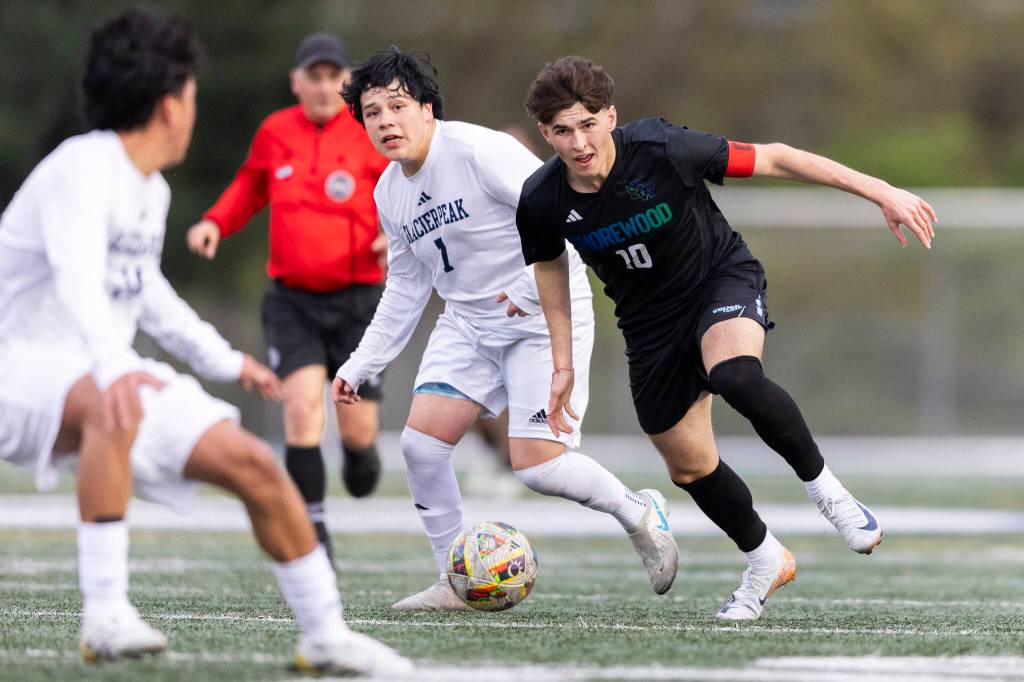 Shorewoods Nikola Genadiev dribbles the ball up the field during the game against Glacier Peak on Tuesday, April 28, 2026 in Shoreline, Washington. (Olivia Vanni / The Herald)