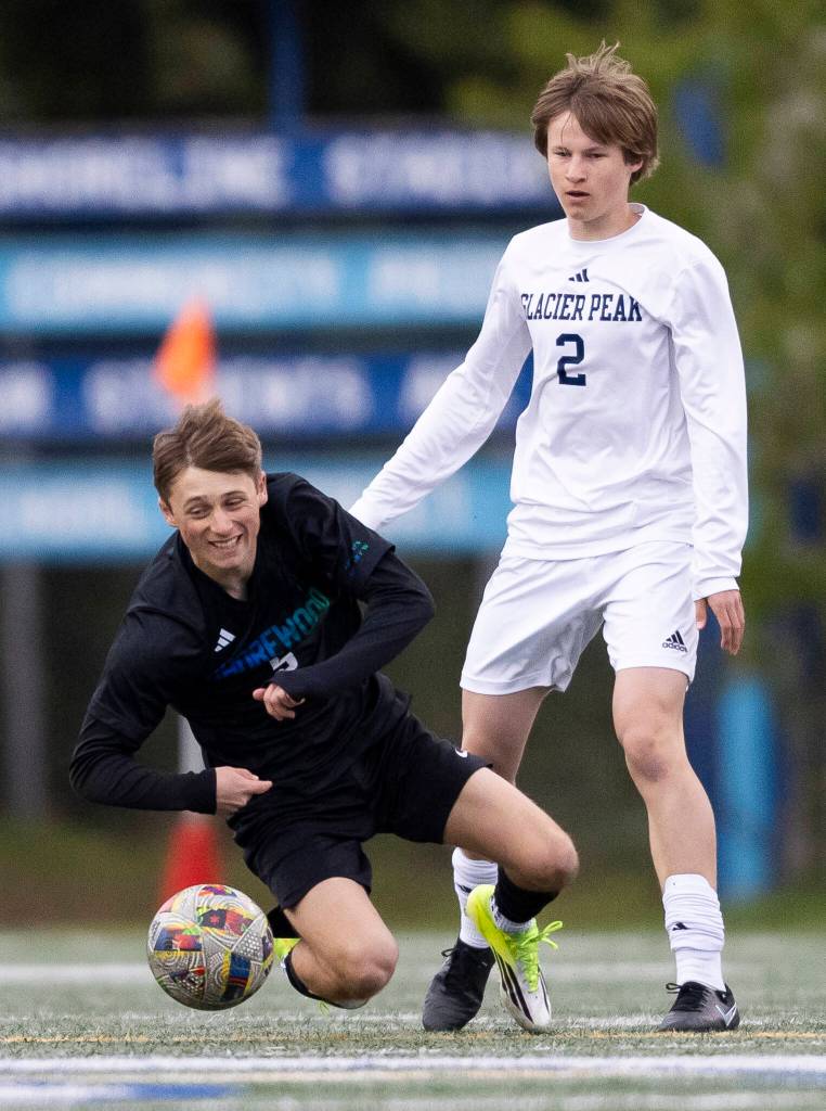 Shorewoods Bobby Lamb falls to the ground after being fouled during the game against Glacier Peak on Tuesday, April 28, 2026 in Shoreline, Washington. (Olivia Vanni / The Herald)