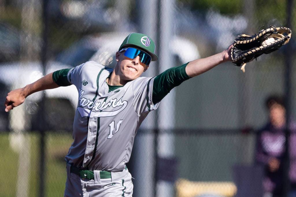 Edmonds-Woodways William Alseth stretches to make a catch at first base for an out during the game against Shorewood on Wednesday, April 29, 2026 in Shoreline, Washington. (Olivia Vanni / The Herald)