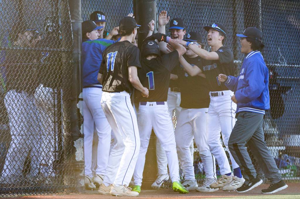 Shorewoods Cameron Falk celebrates with his teammates after scoring during the game against Edmonds-Woodway on Wednesday, April 29, 2026 in Shoreline, Washington. (Olivia Vanni / The Herald)