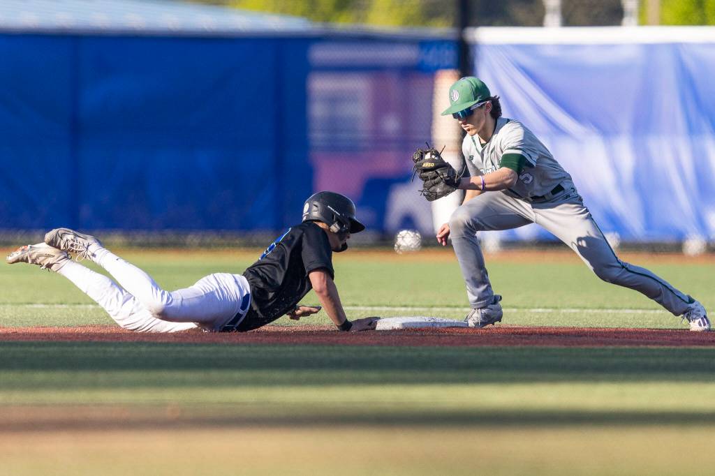Shorewoods Danny Morgan dives back to first base during the game against Edmonds-Woodway on Wednesday, April 29, 2026 in Shoreline, Washington. (Olivia Vanni / The Herald)