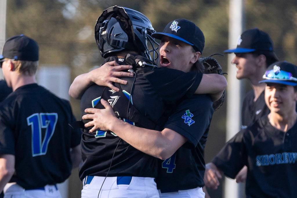 Shorewoods Max Rojas hugs teammates Shorewoods Danny Morgan after beating Edmonds-Woodway on Wednesday, April 29, 2026 in Shoreline, Washington. (Olivia Vanni / The Herald)