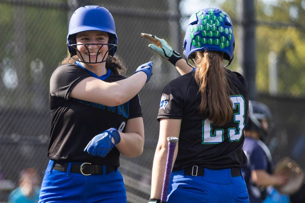 Shorewoods Cailin OLeary high-fives teammate Shorewoods Grace McLaughlin after scoring during the game against Meadowdale on Thursday, April 30, 2026 in Lynnwood, Washington. (Olivia Vanni / The Herald)