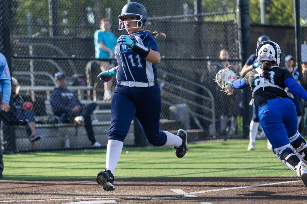Meadowdales Lillian McCormick crosses home plate to score during the game against Shorewood on Thursday, April 30, 2026 in Lynnwood, Washington. (Olivia Vanni / The Herald)