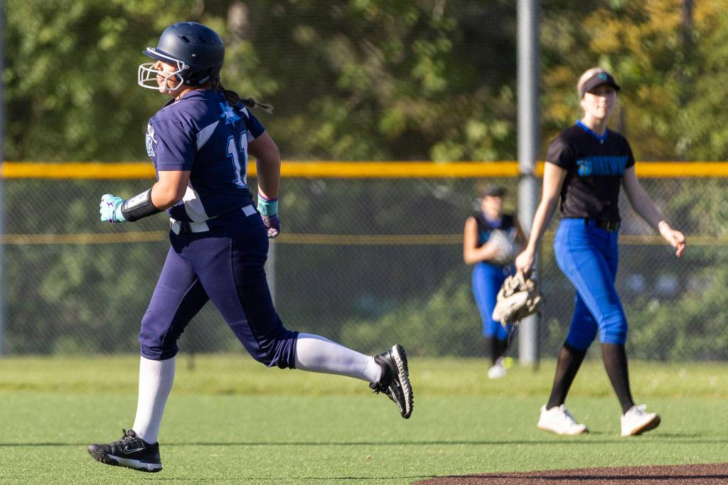 Meadowdales Lillian McCormick runs the bases after hitting a home run during the game against Shorewood on Thursday, April 30, 2026 in Lynnwood, Washington. (Olivia Vanni / The Herald)