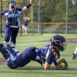 Meadowdales Peyton Warnock makes a diving catch for an out during the game against Shorewood on Thursday, April 30, 2026 in Lynnwood, Washington. (Olivia Vanni / The Herald)