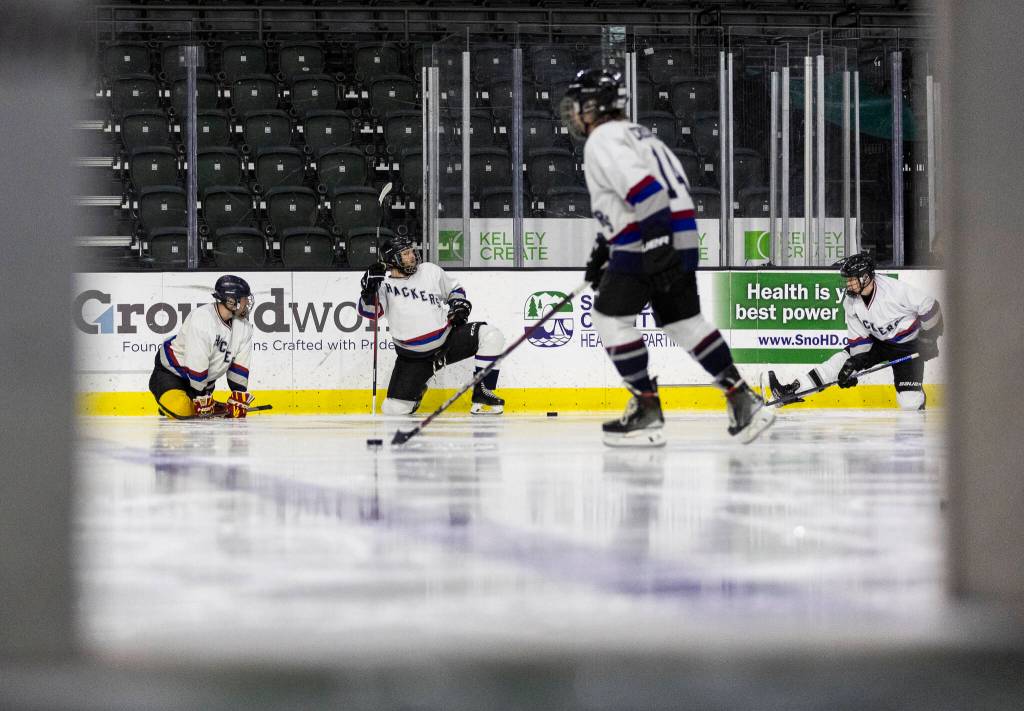 Hackers players warm up before their playoff game at Angel of the Winds Arena on Sunday, March 29, 2026 in Everett, Washington. (Olivia Vanni / The Herald)