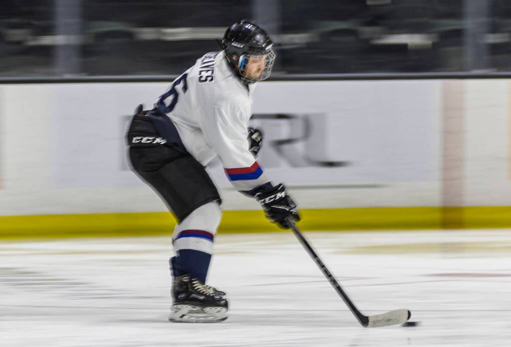 Andrew Greaves carries the puck during the Hackers playoff game at Angel of the Winds Arena on Sunday, March 29, 2026 in Everett, Washington. (Olivia Vanni / The Herald)