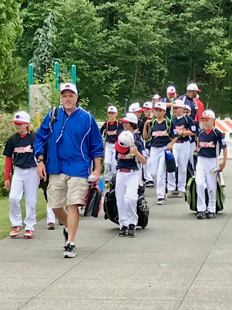 Chris Langsea leads a Mill Creek Little League baseball team to a field. (Photo courtesy of Sarah Langsea)