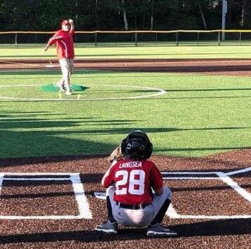 Chris Langsea throws the first pitch on the new turf at Freedom Field to his son, Noah Langsea (28), in Mill Creek, Washington. (Photo courtesy of Sarah Langsea)