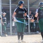 Aliana Langsea high fives a teammate before stepping up to the plate during a game against Kamiak on Monday, April 20, 2026 in Mill Creek, Washington. (Olivia Vanni / The Herald)
