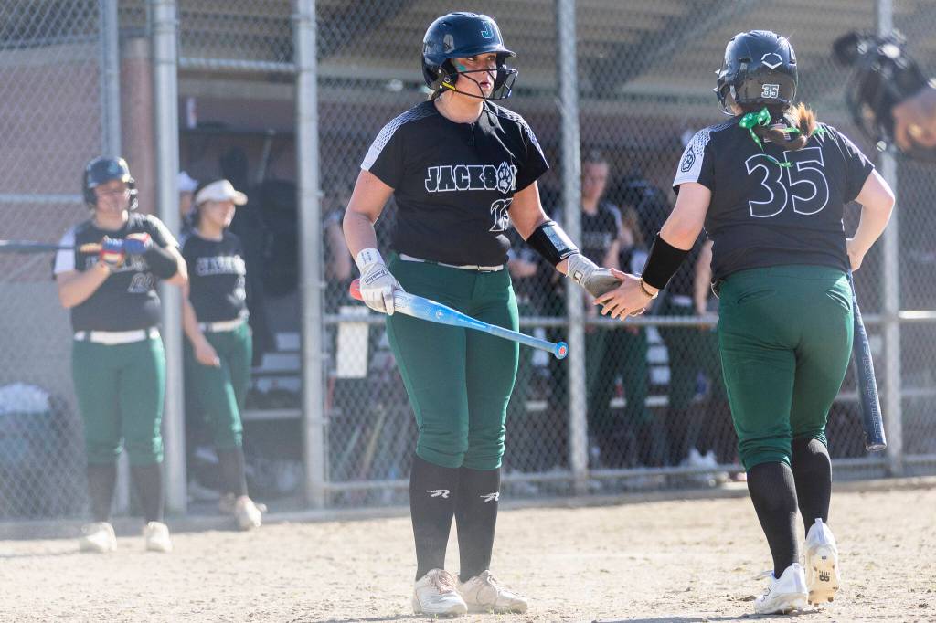 Aliana Langsea high fives a teammate before stepping up to the plate during a game against Kamiak on Monday, April 20, 2026 in Mill Creek, Washington. (Olivia Vanni / The Herald)