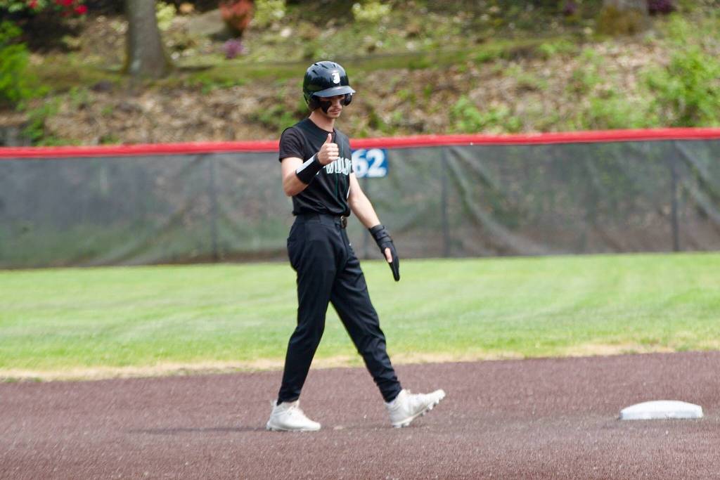 Noah Langsea gives Jackson coach Joe Fleury a thumbs up from second base during Jacksons baseball game against Woodinville at Bannerwood Park in Bellevue, Washington on Saturday, May 8, 2026. (Aaron Coe / The Herald)