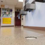 A missing piece of flooring is visible in a hallway at Explorer Middle School on Monday, May 11, 2026 in Everett, Washington. (Olivia Vanni / The Herald)