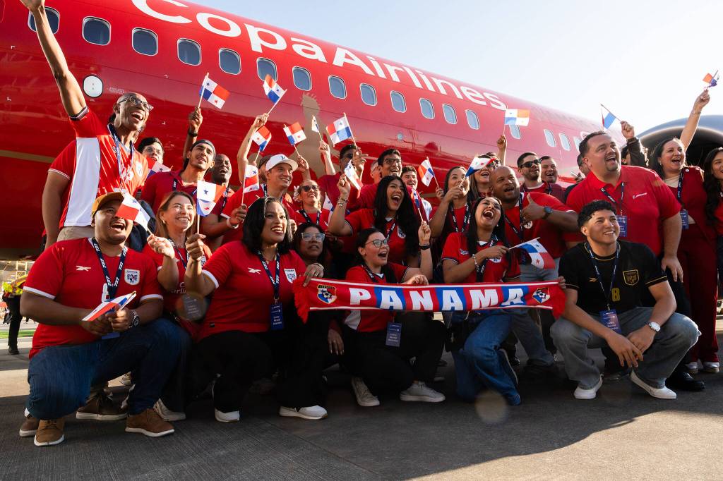 People cheer in front of a new airplane livery for the Panama national soccer team ahead of the 2026 FIFA World Cup on Tuesday in Everett. (Will Geschke / The Herald)