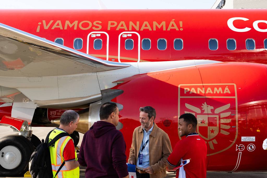 Thomas Christiansen, center right, the head coach of the Panama soccer football team, speaks to Panamanian reporters on Tuesday in Everett. (Will Geschke / The Herald)