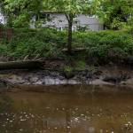 A house sits above Allen Creek on Tuesday, May 5, 2026 in Marysville, Washington. (Olivia Vanni / The Herald)