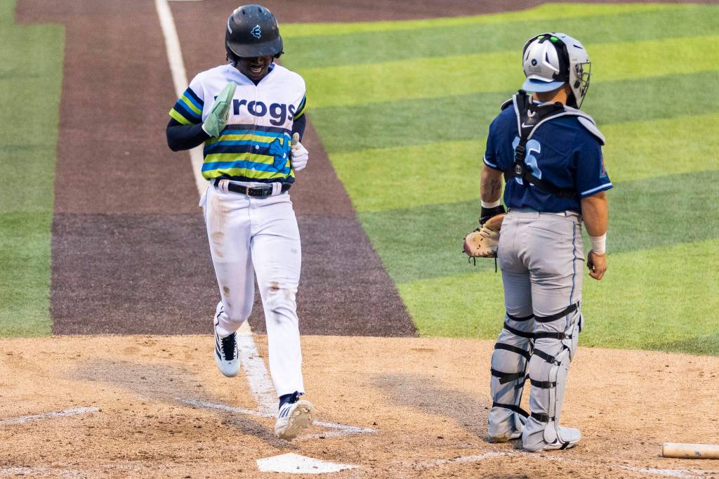 Felnin Celesten #5 of the Everett AquaSox scores during the game against the Hillsboro Hops on Wednesday, May 6, 2026 in Everett, Washington. (Olivia Vanni / The Herald)