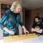 Beverly Hoback plays a song on a dulcimer while her son Joel listens on Thursday, May 7, 2026 in Arlington, Washington. (Olivia Vanni / The Herald)