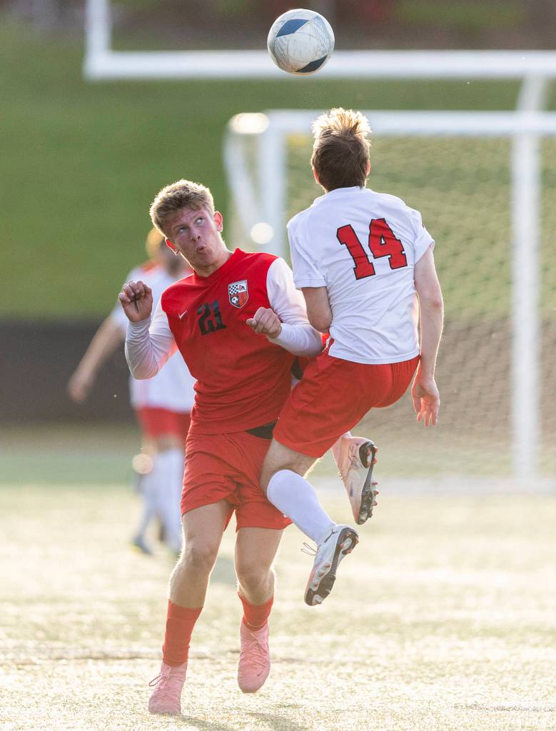Snohomishs Carson Maechler and Mountlake Terraces Owen Smith battle for the ball during the loser-out 3A district playoff game on Thursday, May 7, 2026 in Snohomish, Washington. (Olivia Vanni / The Herald)