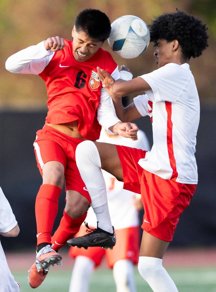 Snohomishs Brian Flores Machuca and Mountlake Terraces Rafeal Tewolde jump to head the ball during the loser-out 3A district playoff game on Thursday, May 7, 2026 in Snohomish, Washington. (Olivia Vanni / The Herald)