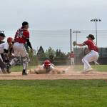Snohomishs Breckin Davisson slides into home plate during a District 1 3A quarterfinal game against Mountlake Terrace on Saturday, May 9, 2026 at Snohomish H.S. in Snohomish. (Qasim Ali / The Herald)