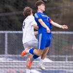 Lynnwoods Vladyslav Tarasiuk and Shorewoods Daniel Bruno jump up to head the ball during the 3A district semifinal game on Tuesday, May 12, 2026 in Shoreline, Washington. (Olivia Vanni / The Herald)