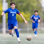 Shorewoods Nikola Genadiev dribbles the ball up the field during the 3A district semifinal game against Lynnwood on Tuesday, May 12, 2026 in Shoreline, Washington. (Olivia Vanni / The Herald)