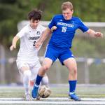 Shorewoods Caleb Butler and Lynnwoods Samson Ilano battle for the ball during the 3A district semifinal game on Tuesday, May 12, 2026 in Shoreline, Washington. (Olivia Vanni / The Herald)
