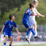 Shorewoods Meiron Bereket and Lynnwoods Brandon Miller jump up to head the ball during the 3A district semifinal game on Tuesday, May 12, 2026 in Shoreline, Washington. (Olivia Vanni / The Herald)