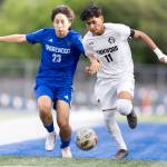 Shorewoods Ian Baxter and Lynnwoods Henrry Torres-Hernandez battle for the ball during the 3A district semifinal game on Tuesday, May 12, 2026 in Shoreline, Washington. (Olivia Vanni / The Herald)