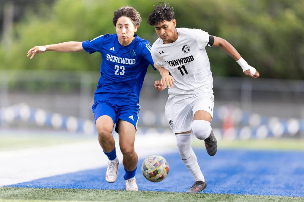 Shorewoods Ian Baxter and Lynnwoods Henrry Torres-Hernandez battle for the ball during the 3A district semifinal game on Tuesday, May 12, 2026 in Shoreline, Washington. (Olivia Vanni / The Herald)