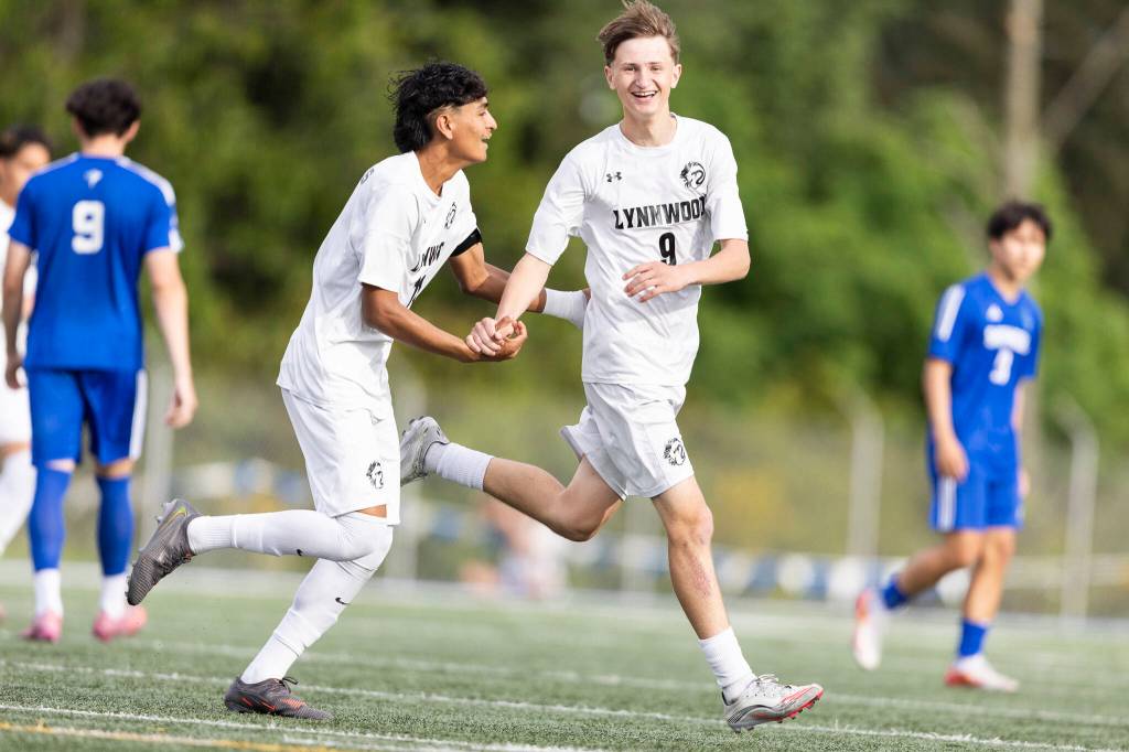 Lynnwoods Vladyslav Tarasiuk celebrates after scoring with Lynnwoods Henrry Torres-Hernandez during the 3A district semifinal game against Shorewood on Tuesday, May 12, 2026 in Shoreline, Washington. (Olivia Vanni / The Herald)