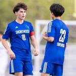 Shorewoods Nikola Genadiev and Shorewoods Ian Baxter talk during the 3A district semifinal game against Lynnwood on Tuesday, May 12, 2026 in Shoreline, Washington. (Olivia Vanni / The Herald)