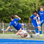 Shorewoods Isak Medhaug leaps over Lynnwoods Brandon Miller as Shorewoods Bobby Lamb takes a shot during the 3A district semifinal game on Tuesday, May 12, 2026 in Shoreline, Washington. (Olivia Vanni / The Herald)