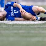 Shorewoods Julian Shook grabs his knee after drawing a foul during the 3A district semifinal game against Lynnwood on Tuesday, May 12, 2026 in Shoreline, Washington. (Olivia Vanni / The Herald)