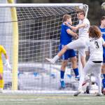 Shorewood and Lynnwood players jump up for a corner kick during the 3A district semifinal game on Tuesday, May 12, 2026 in Shoreline, Washington. (Olivia Vanni / The Herald)