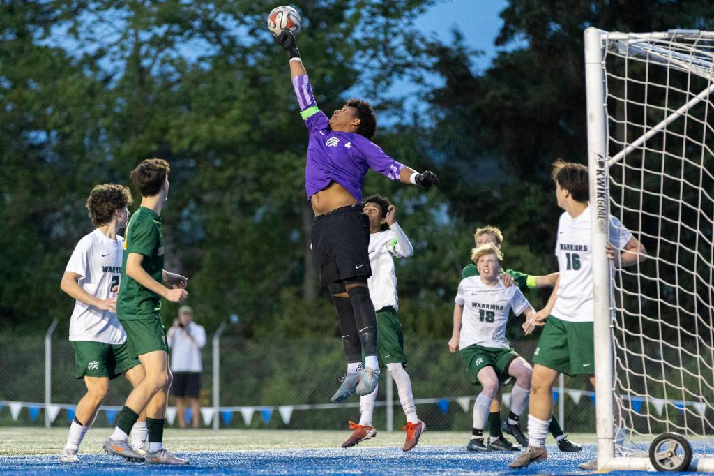 Edmonds-Woodways Isaiah Zabel blocks a shot during the 3A district semifinal game against Shorecrest on Tuesday, May 12, 2026 in Shoreline, Washington. (Olivia Vanni / The Herald)