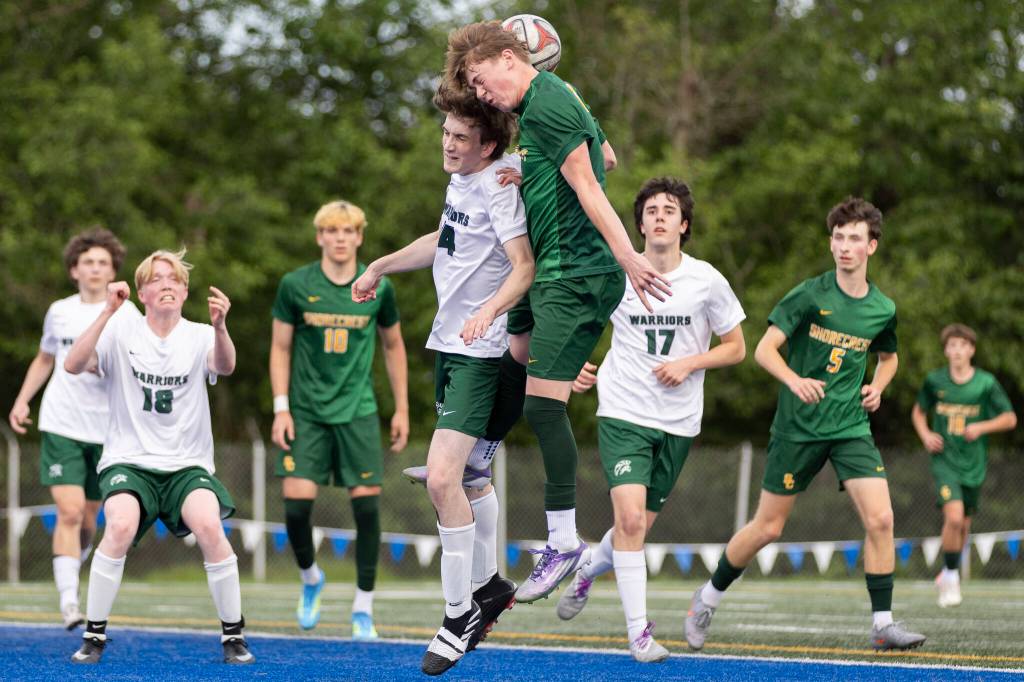 Edmonds-Woodways Will Bourbonnais and Shorecrests Kai Short jump up to head a corner kick during the 3A district semifinal game on Tuesday, May 12, 2026 in Shoreline, Washington. (Olivia Vanni / The Herald)