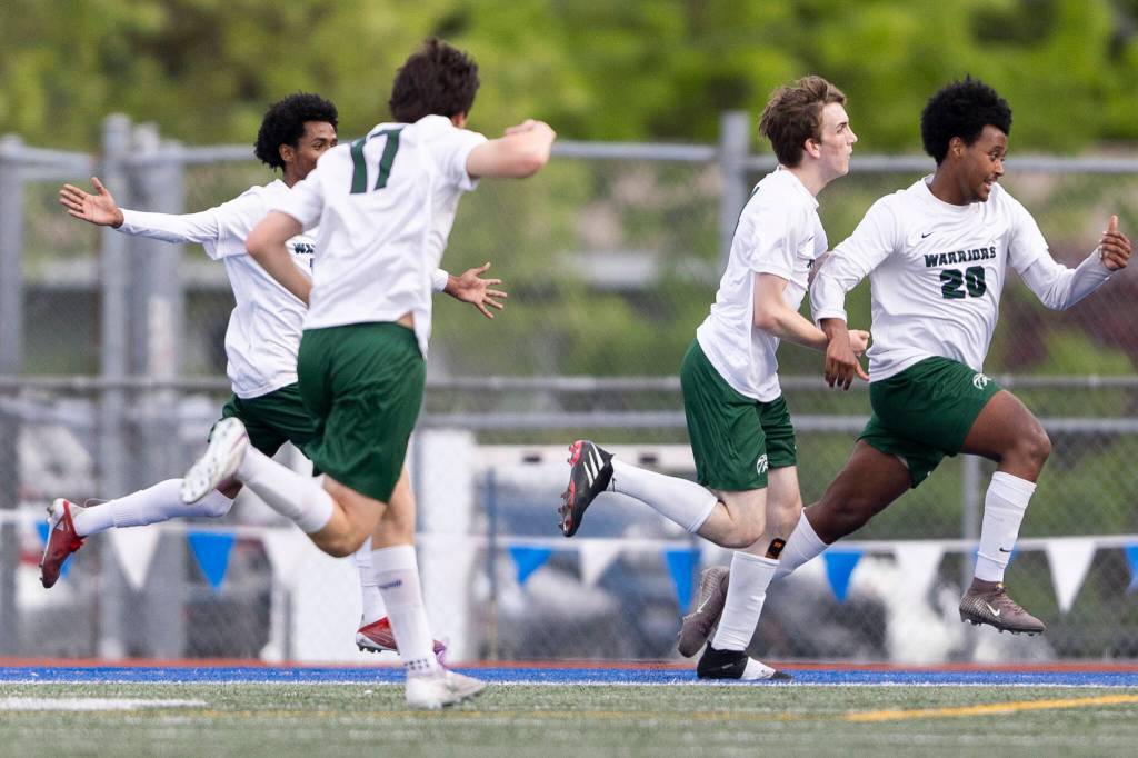 Edmonds-Woodways Neaphtali Daniel and teammates react to his goal during the 3A district semifinal game against Shorecrest on Tuesday, May 12, 2026 in Shoreline, Washington. (Olivia Vanni / The Herald)