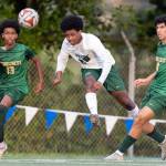 Edmonds-Woodways Neaphtali Daniel crosses the ball while under pressure from Shorecrests Nani Dereje and Ameen Tirhi during the 3A district semifinal game on Tuesday, May 12, 2026 in Shoreline, Washington. (Olivia Vanni / The Herald)