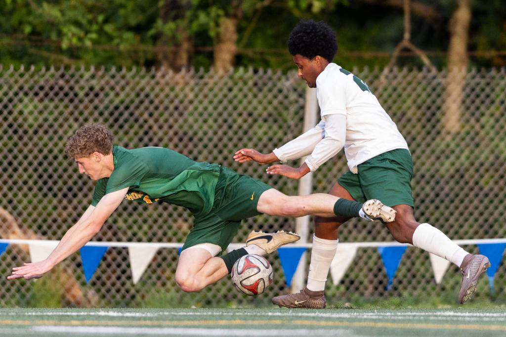 Edmonds-Woodways Neaphtali Daniel pushes Shorecrests Blake Mason off of the ball during the 3A district semifinal game on Tuesday, May 12, 2026 in Shoreline, Washington. (Olivia Vanni / The Herald)