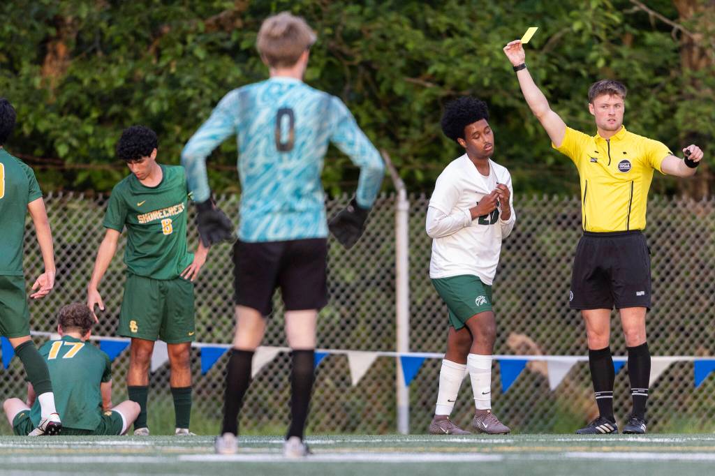 Edmonds-Woodways Neaphtali Daniel reacts to getting a yellow card during the 3A district semifinal game against Shorecrest on Tuesday, May 12, 2026 in Shoreline, Washington. (Olivia Vanni / The Herald)