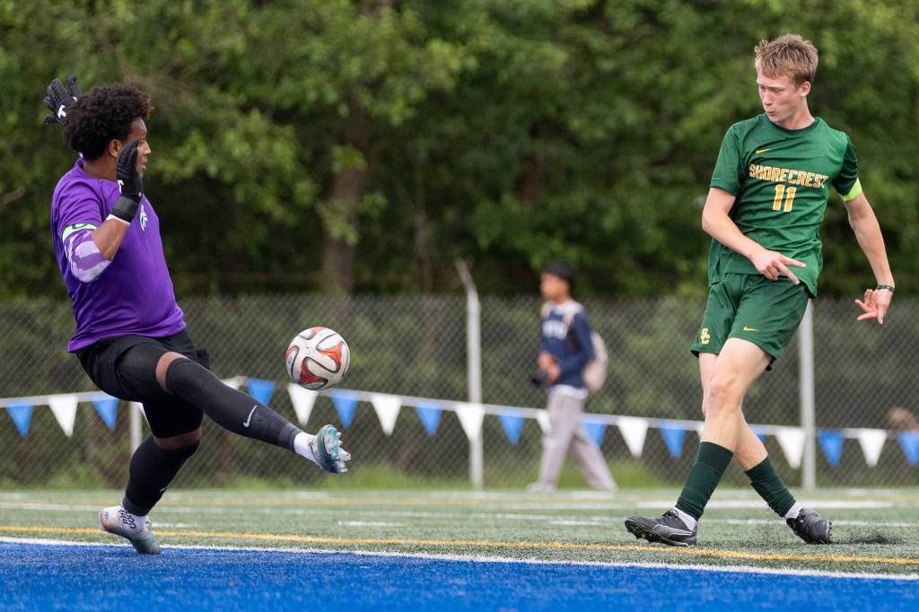 Edmonds-Woodways Isaiah Zabel blocks a shot by Shorecrests Ashton Johnson during the 3A district semifinal game on Tuesday, May 12, 2026 in Shoreline, Washington. (Olivia Vanni / The Herald)