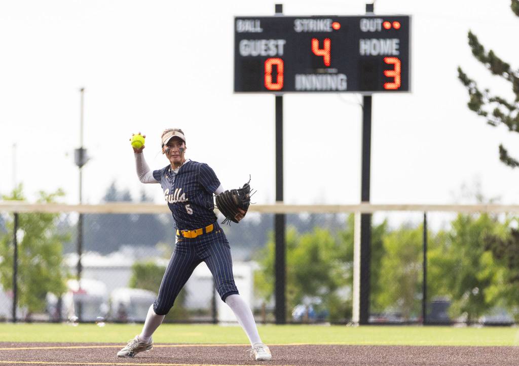 Everetts Mia Hoekendorf fields the ball and throws to first base during the 3A district championship game against Sedro-Woolley on Thursday, May 14, 2026 in Everett, Washington. (Olivia Vanni / The Herald)